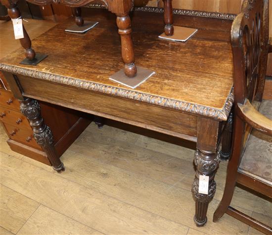 A small oak side table W.99cm